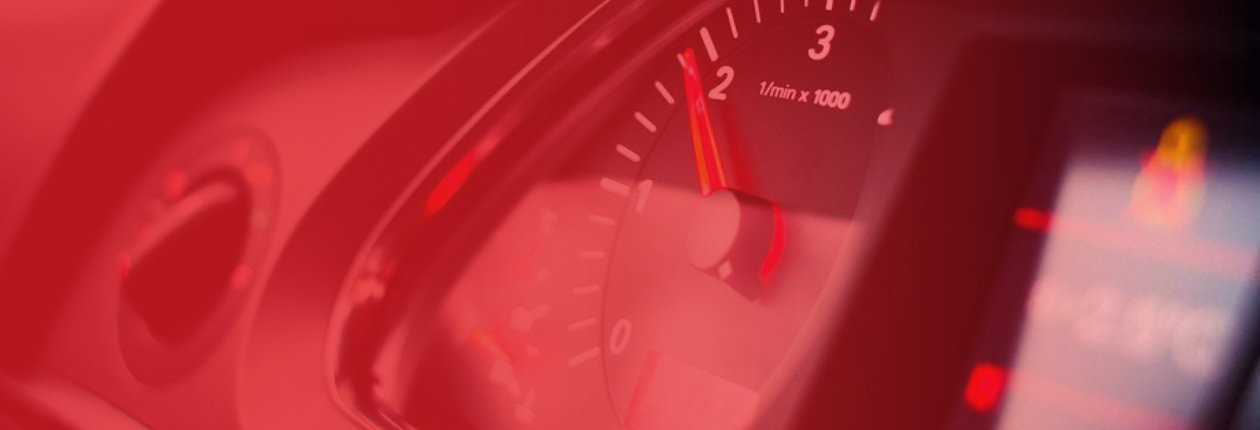 Close up image of car rev counter. Our prices are the same whether manual or automatic.