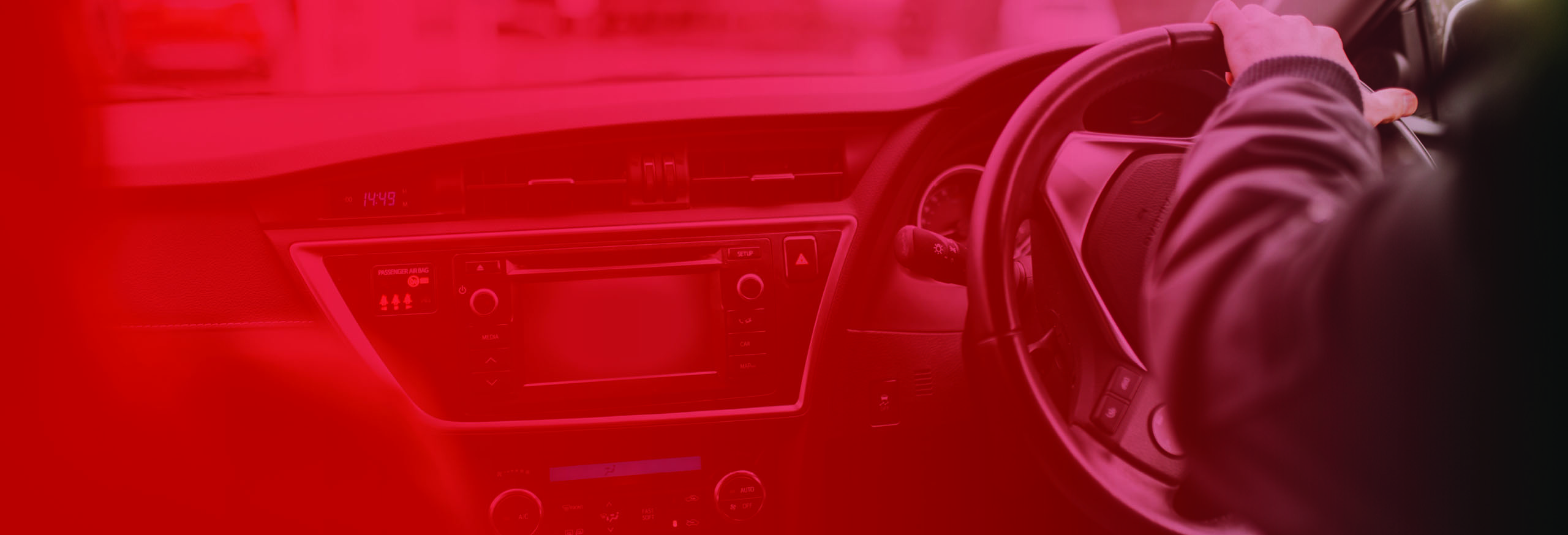 Full dashboard of modern car with male driver's hands on the steering wheel. Automatic Driving Lessons in Worcester.